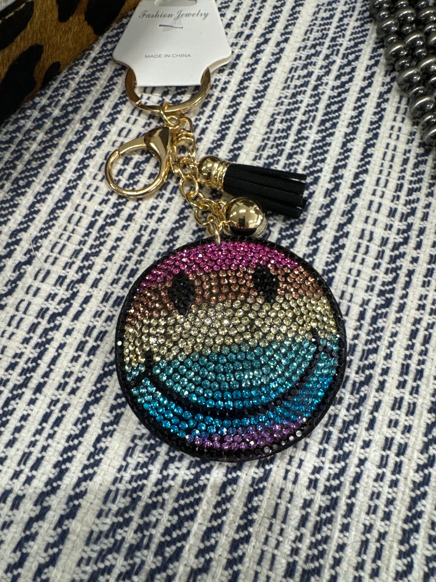 KEY CHAIN-GLITTER -MLT SMILEY FAC