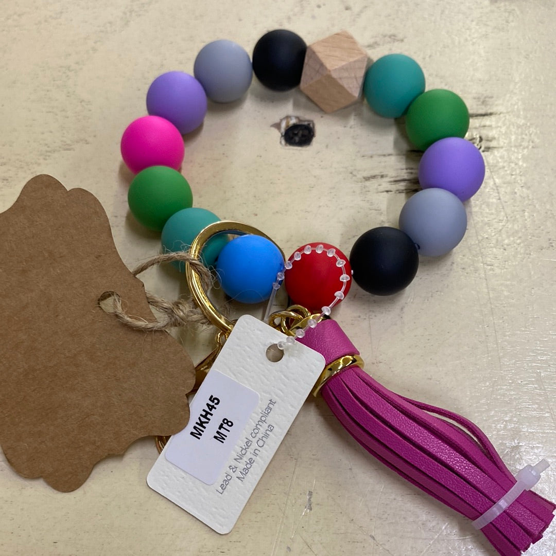 WOODEN KEY RING MULTI-PINK TASSEL